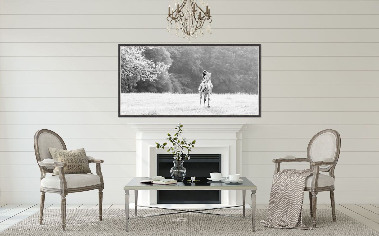 A black and white photo of a giraffe in front of a fireplace.